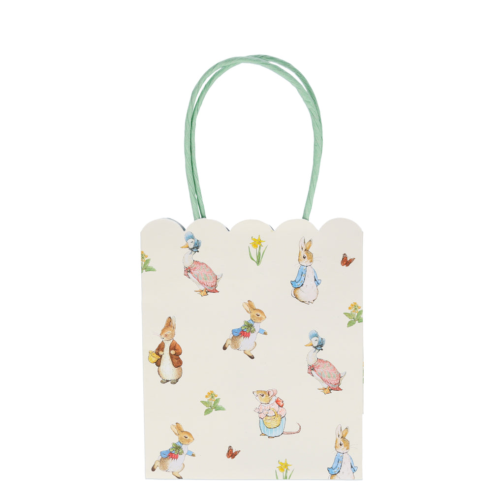 Delight your guests with these charming party bags featuring the wonderful Peter Rabbit and friends. They are beautifully designed with scallop edges and colourful handles.