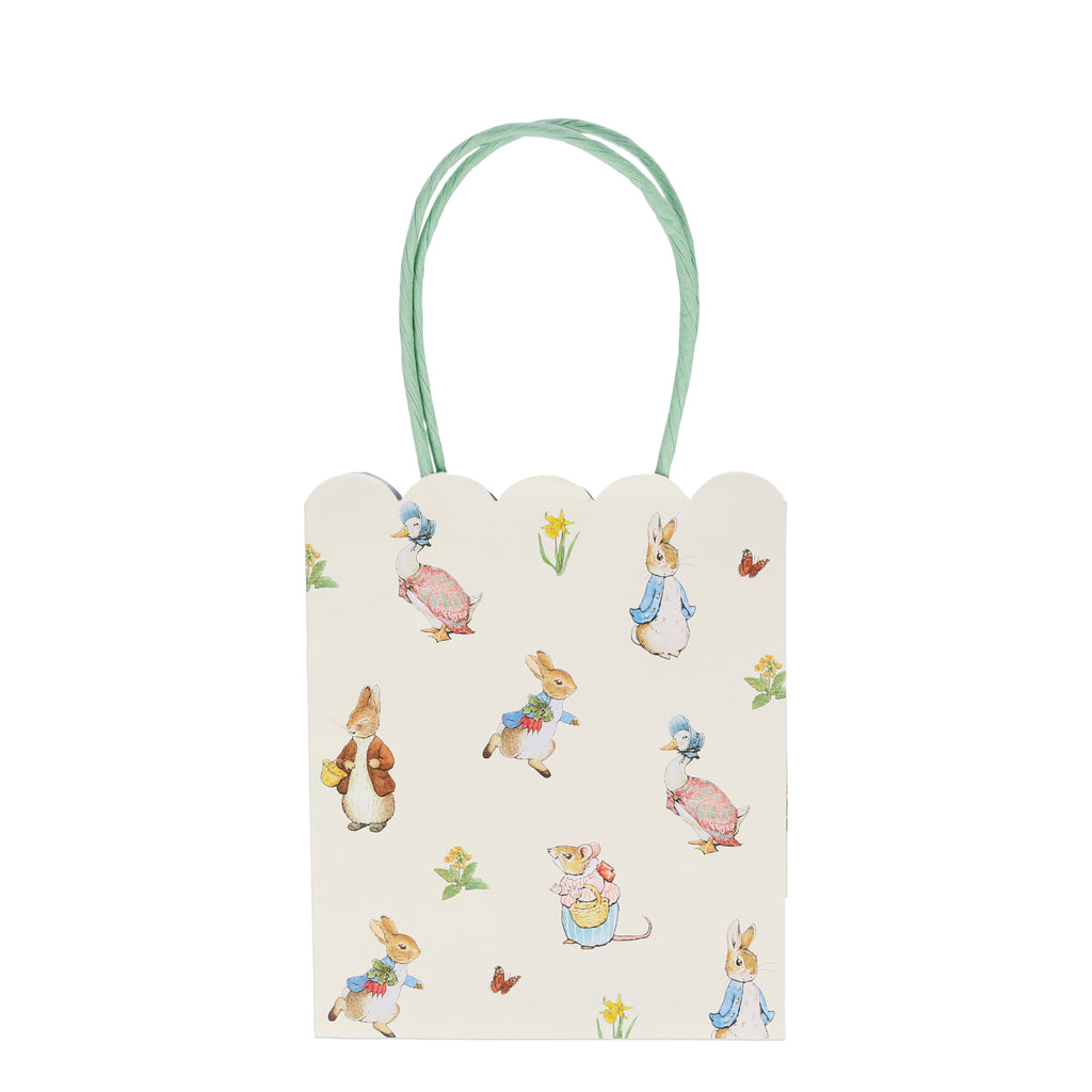 Delight your guests with these charming party bags featuring the wonderful Peter Rabbit and friends. They are beautifully designed with scallop edges and colourful handles.