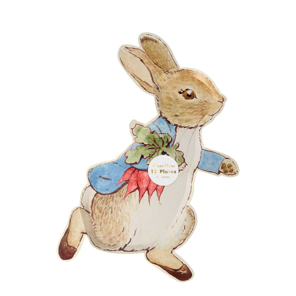 Meri Meri Peter Rabbit plate. Peter rabbit is holding a bunch of radishes and wearing a blue coat with little brown slippers.