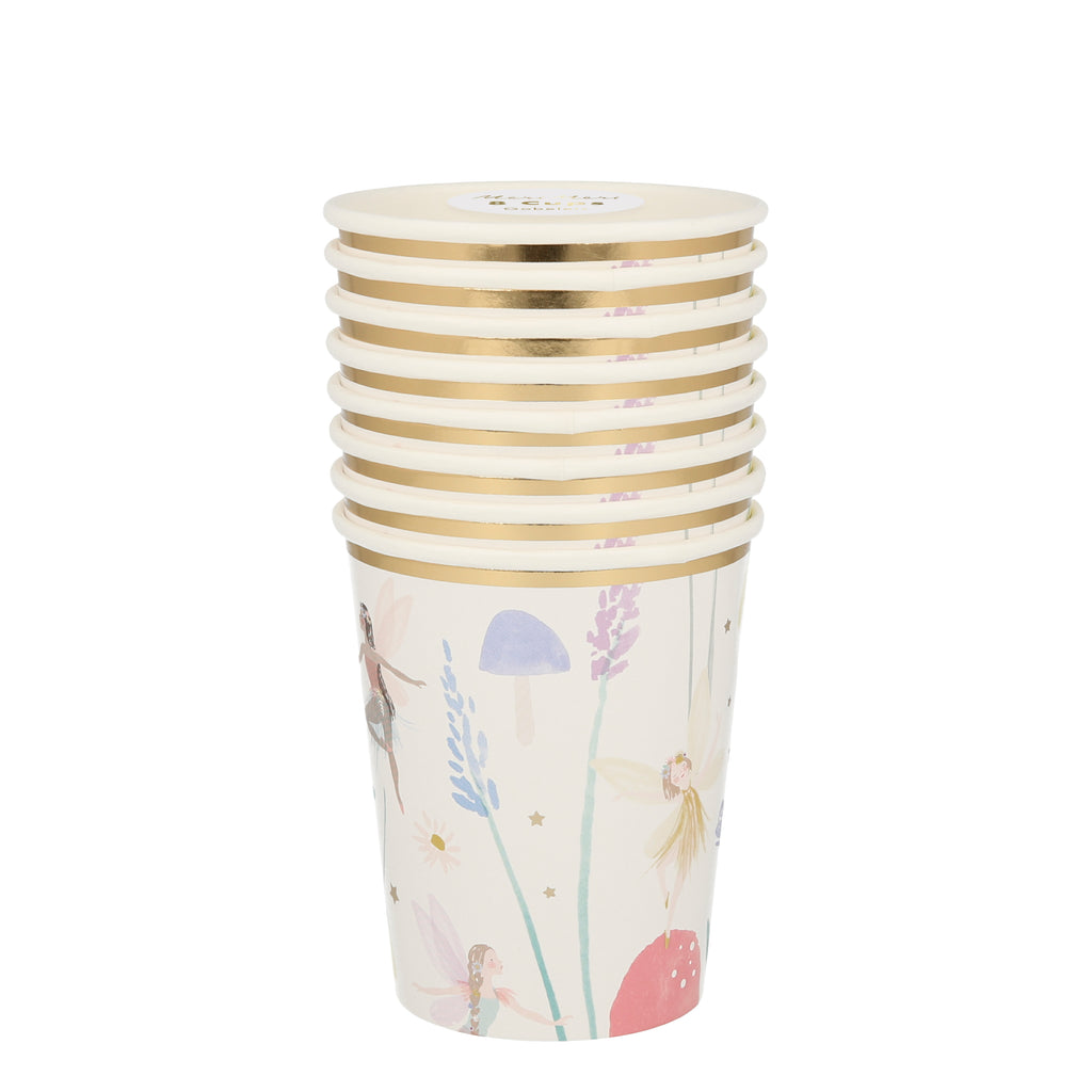 Stack of paper cups with watercolour fairies with their wings open standing on a toadstool. There are gold stars and lavender stalks in pastel colours.
