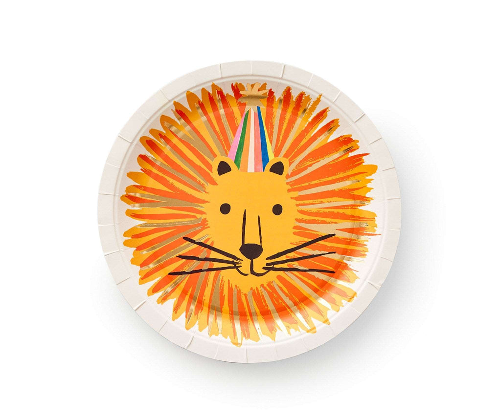 White paper plate has a lion face in the middle with a gold, yellow and orange mane painted in brush strocks. The lion is shown wearing a stripped party hat.