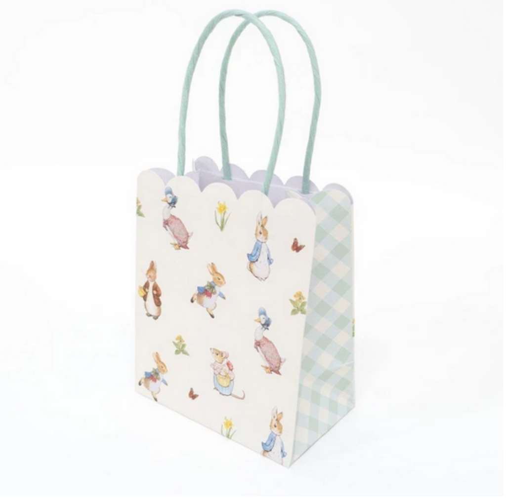 Delight your guests with these charming party bags featuring the wonderful Peter Rabbit and friends. They are beautifully designed with scallop edges and colourful handles.